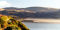 View across estuary from hill (Dinas Oleu) behind Barmouth at mouth of estuary: full size view=54K